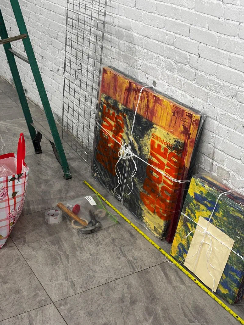 Works still wrapped in plastic before the hanging at RCHIVE, June 2026.