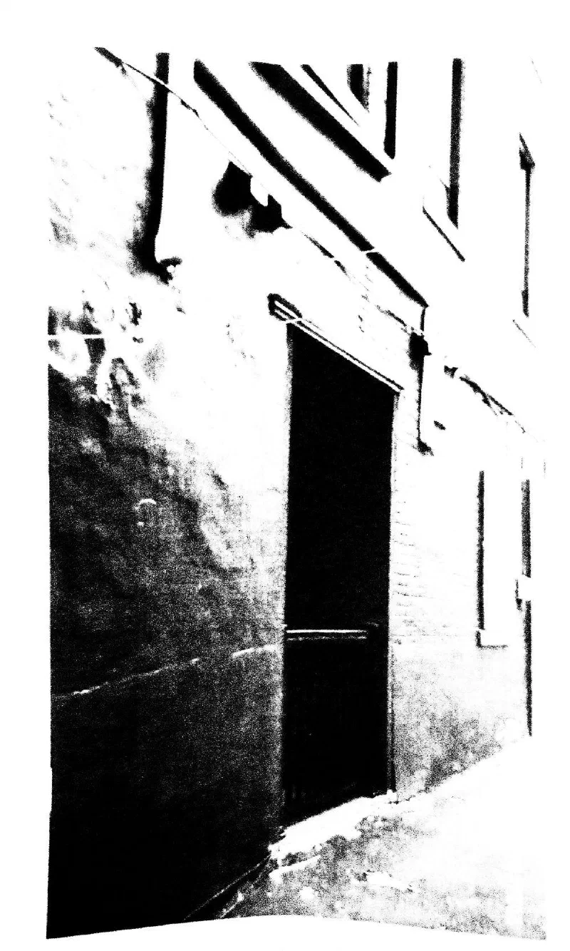 A doorway in an old brick wall.