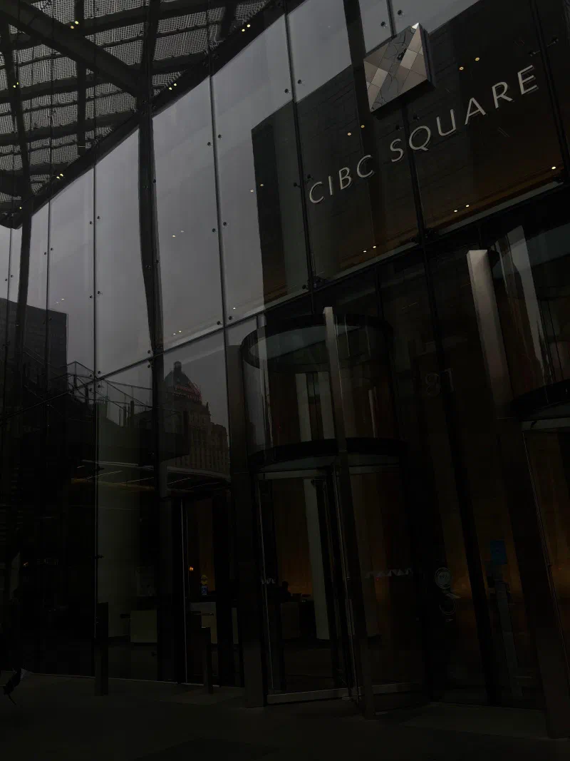 The glass entrance of CIBC Square, Toronto, August 2026.