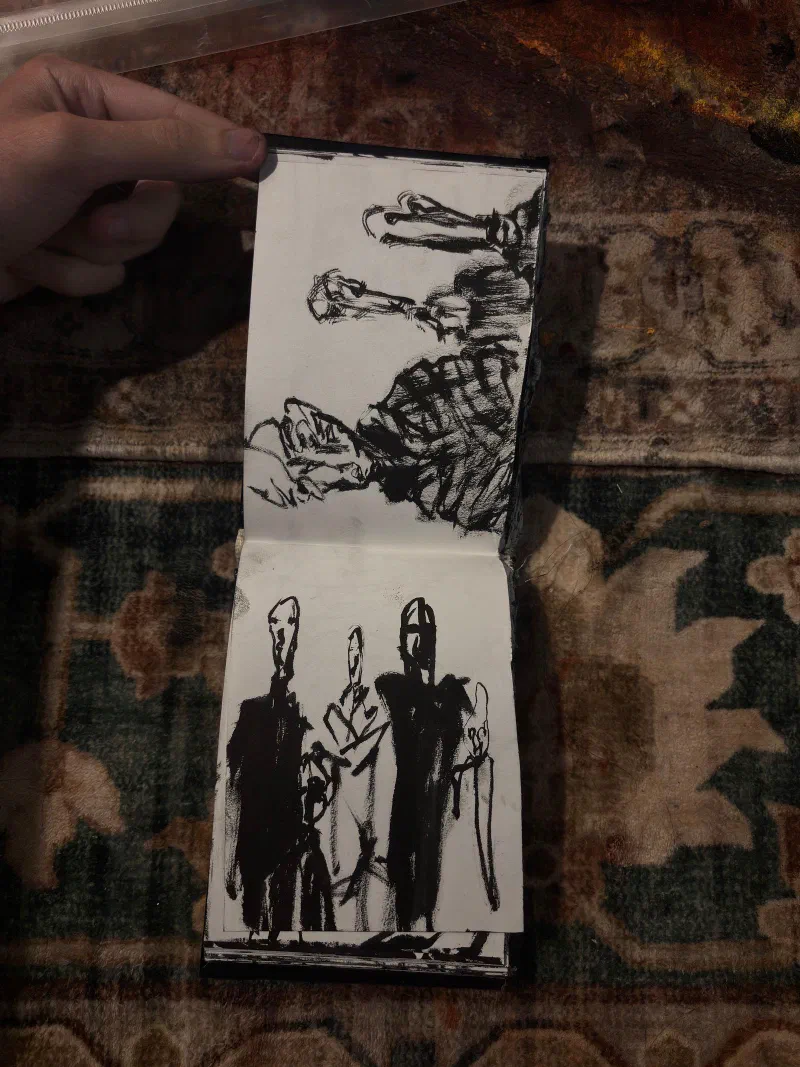 A sketchbook spread: heads above a group of standing figures, August 2026.